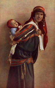 Bedouin mother with her child on her shoulders